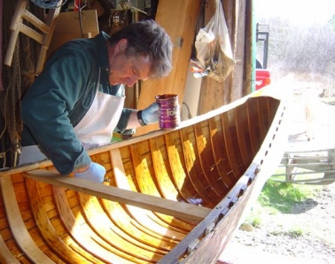 Don working on a canoe